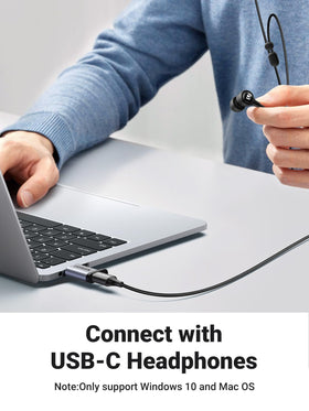 UGREEN adapter next to ruler showing small size for easy portability