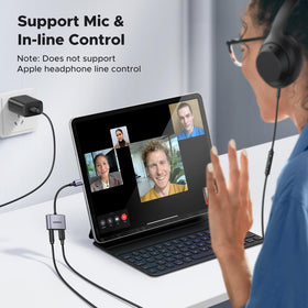 UGREEN USB-C to 3.5mm adapter in use with laptop charges while listening