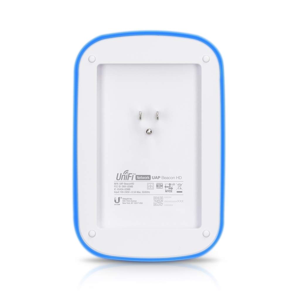 UniFi Wall Plug Extender on a living room wall illustrating broad reach.
