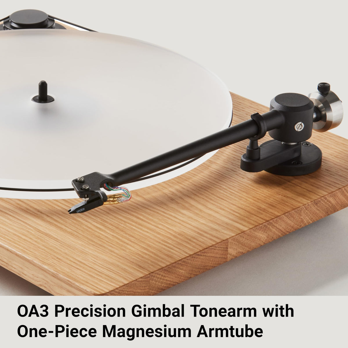 U-Turn Audio Orbit Plus Gen 2 Oak platter detail highlighting grooved acrylic for speed consistency.