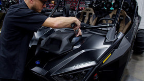 UTV Stereo grille removal frame shows camera clip snapping into place