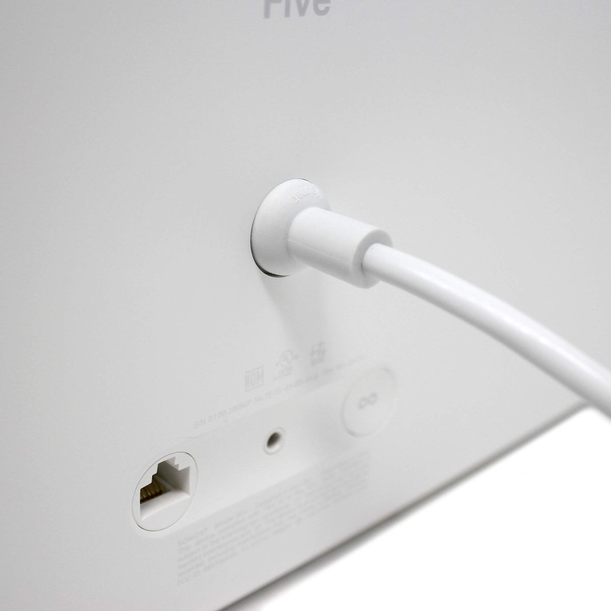Vebner power cord connected to Sonos Arc under TV showing tidy, functional home theater setup
