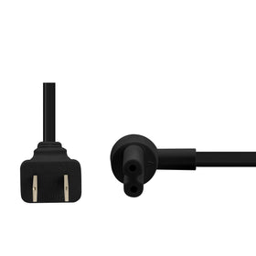 Vebner hand holding plug for scale emphasizing size and ease of routing behind furniture