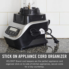 VELCRO Brand Cable Clips attached to a kitchen appliance keep cords tidy.