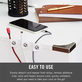 VELCRO Brand Cord Keepers applied to nightstand manage bedside chargers.