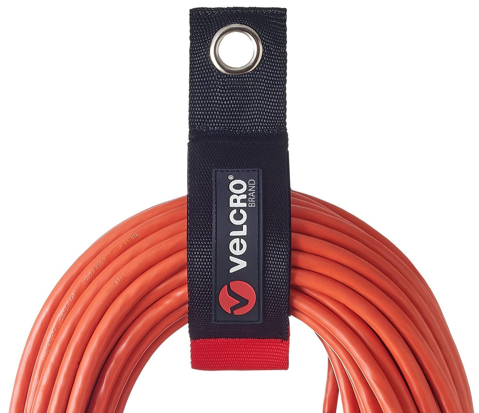 VELCRO Brand Easy Hang Extension Cord Strap mounted for quick cord access and organization.
