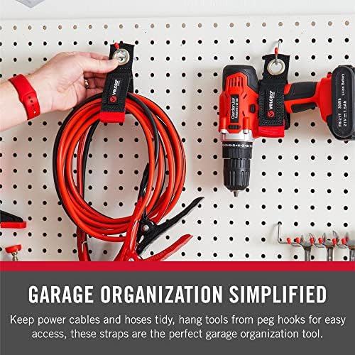 Garage wall organizer setup showing Velcro Easy Hang strap managing cords.