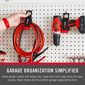 Garage wall organizer setup showing Velcro Easy Hang strap managing cords.