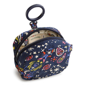 Vera Bradley earbud bag clipped to backpack demonstrating quick access benefit