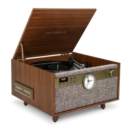 Victrola Century Signature+ clock-lit front view enhances living room ambiance.