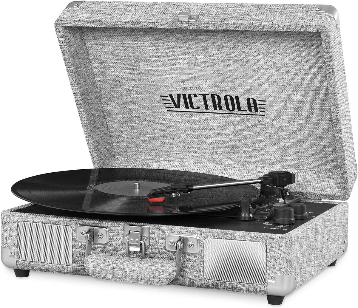 Victrola Journey open playing a vinyl record, Bluetooth convenience shown