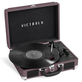 Victrola Journey front view in magenta showing vintage suitcase look and portability