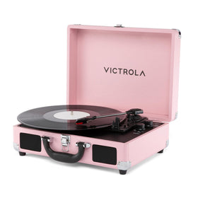 Victrola Journey II pink front view shows portable suitcase turntable with built-in speakers for easy listening
