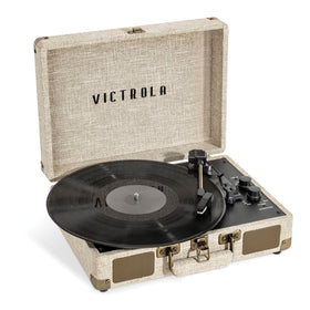 Victrola Journey+ Signature linen cream finish on a portable suitcase turntable, adding vintage style.