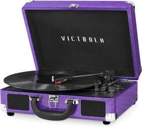 Victrola Journey purple glitter suitcase shown as portable retro listening