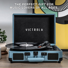 Victrola Journey next to a laptop for scale illustrating compact footprint benefit