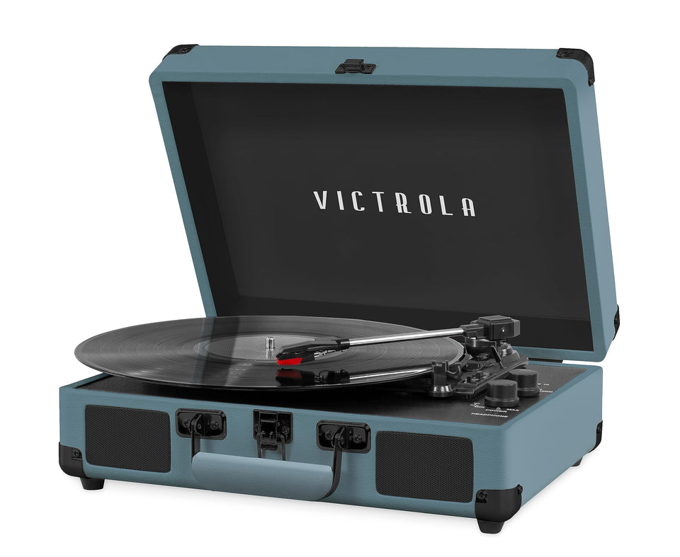 Victrola Journey smoky blue suitcase exterior with carrying handle enables portable listening anywhere