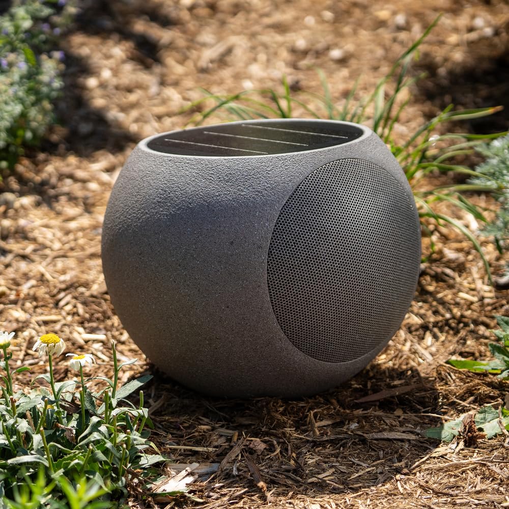 Victrola Zen solar panel on top powering all-day outdoor playback.