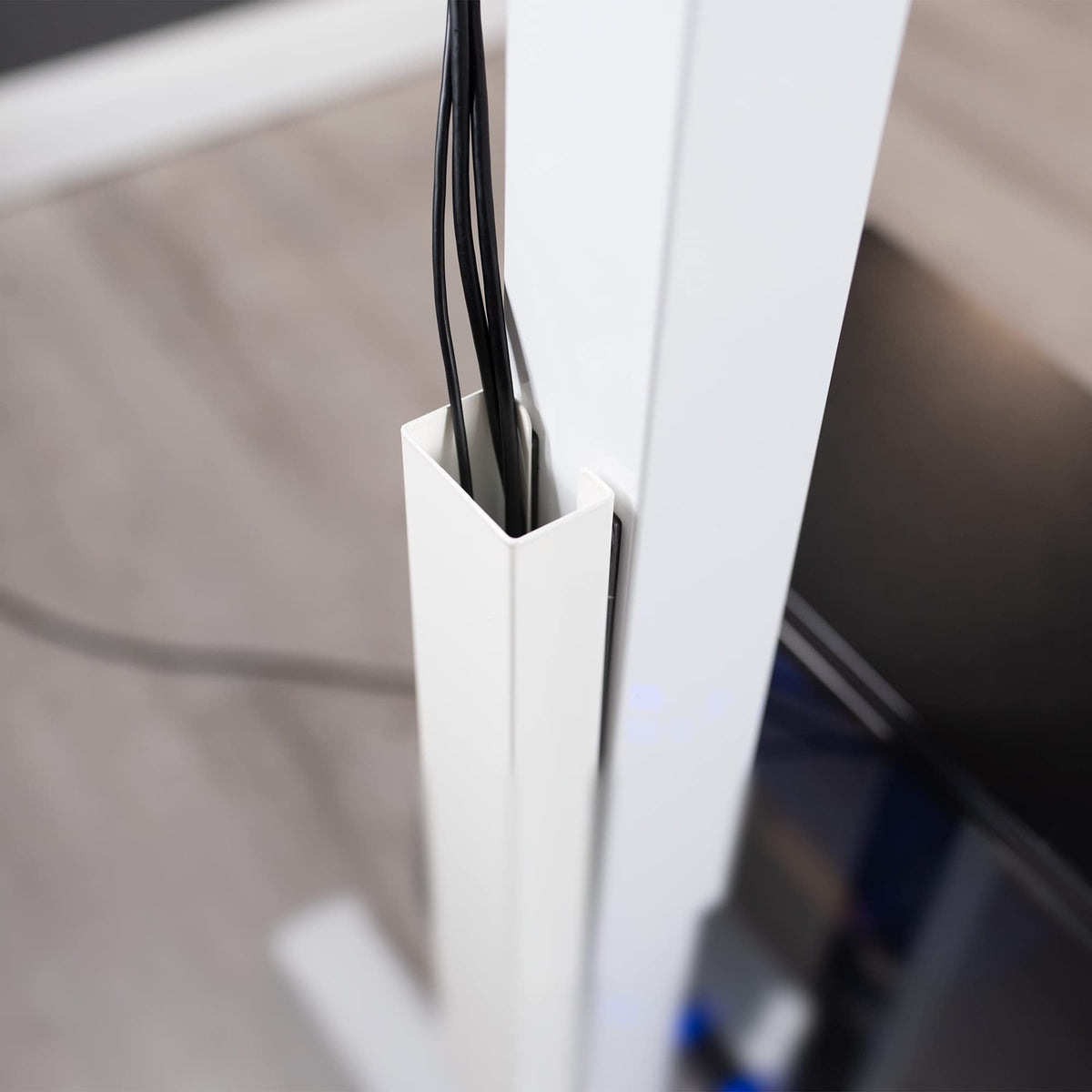 Custom placement along the desk leg offers flexible routing options.