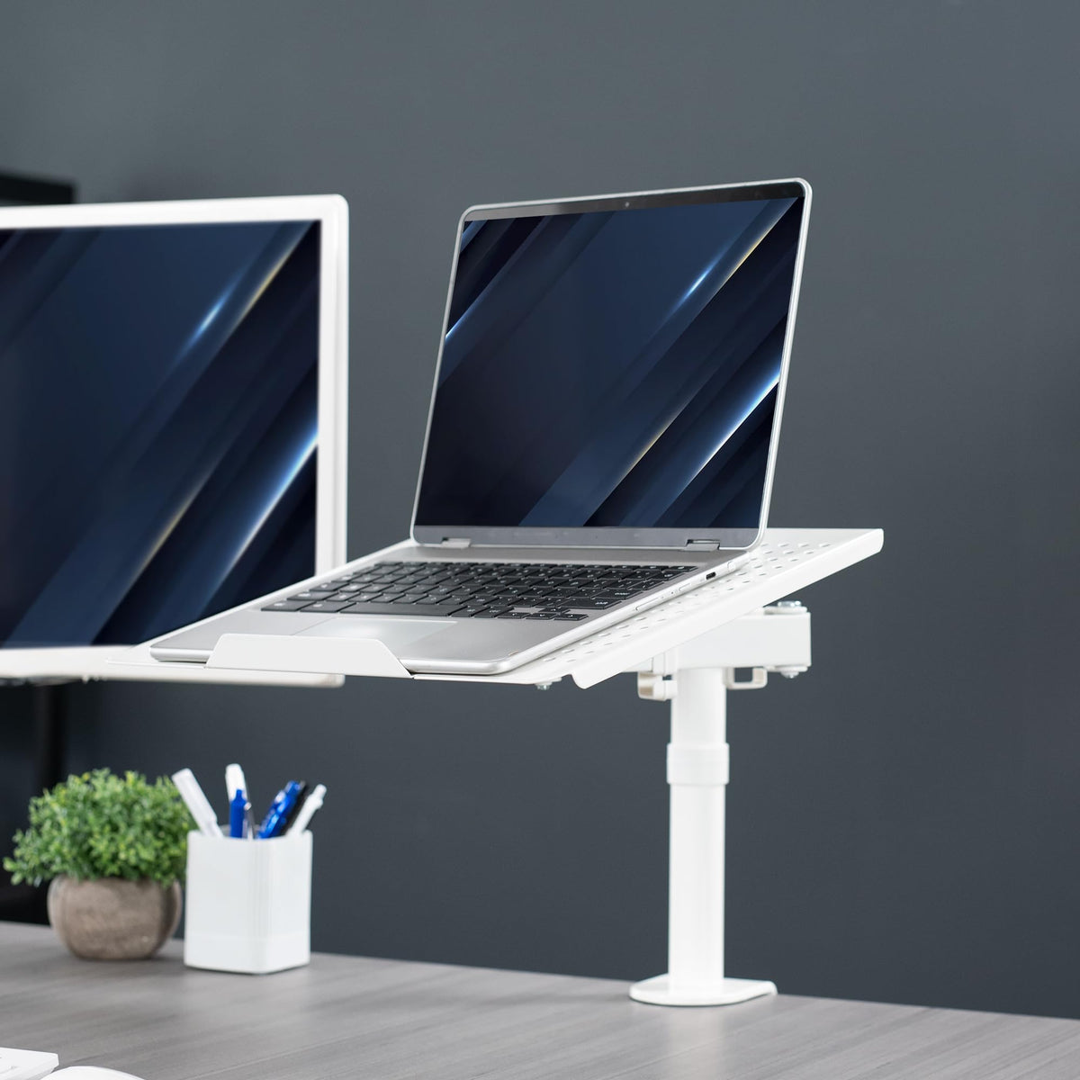 VIVO laptop stand in modern office showing ergonomic workflow benefit