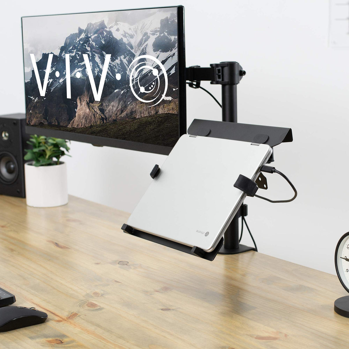 VIVO laptop on arm beside pole showing scale and real-world fit on desk
