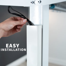 Standing desk cable routing solution minimizes snag risk during height adjustments.