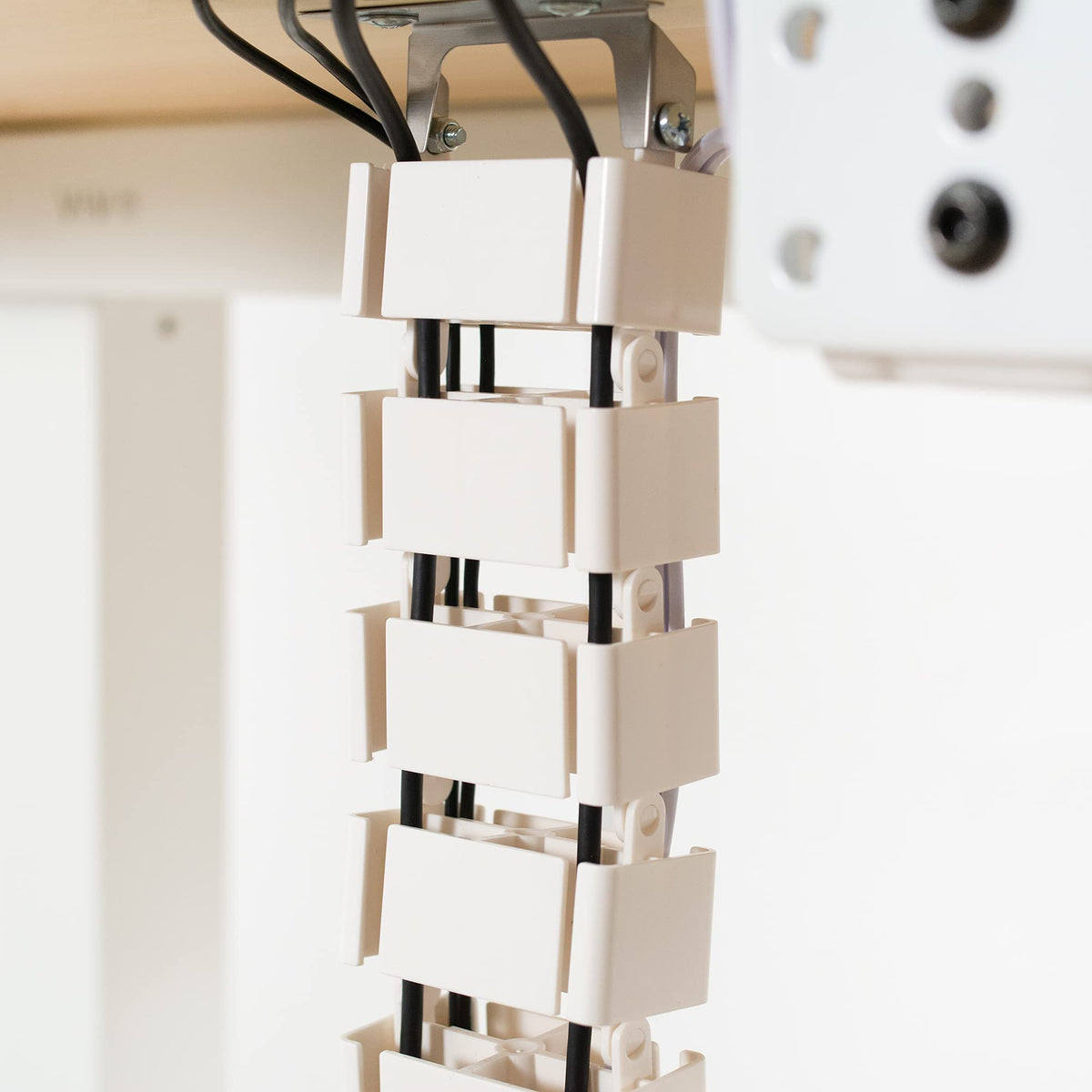 VIVO vertebrae mounted under desk showing secure hook attachment