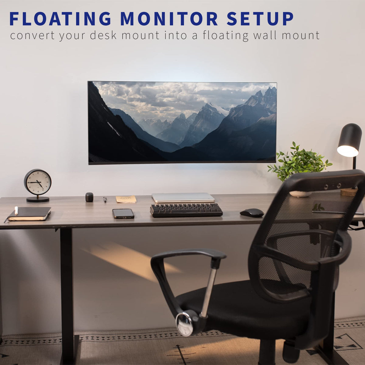 Floating monitor above desk reduces clutter while maintaining ergonomic viewing height.
