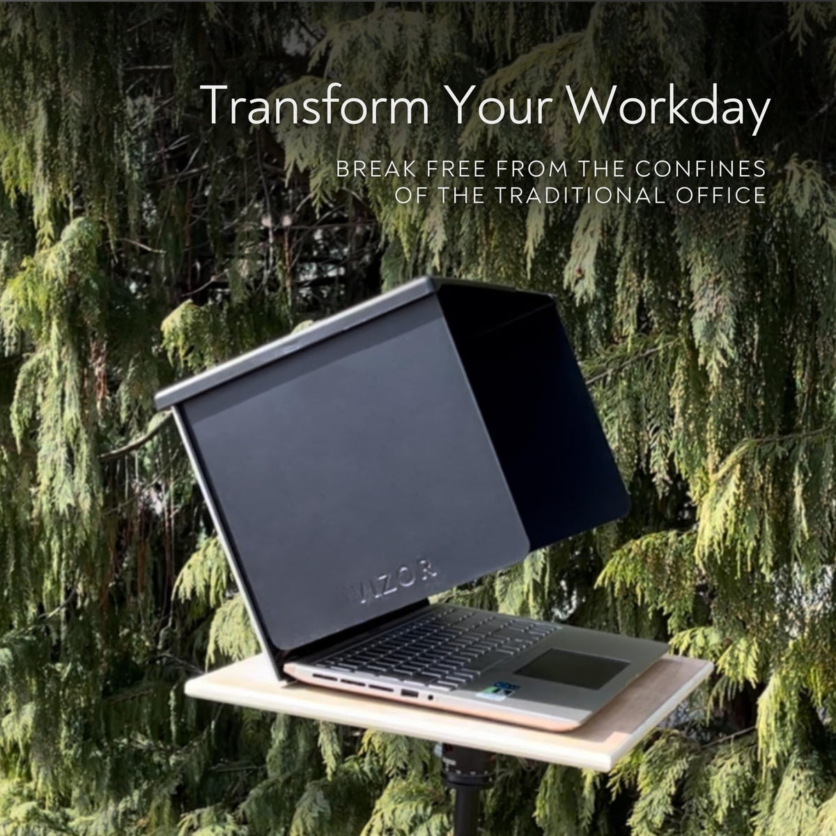 The Outdoor Workplace VIZOR mounted on laptop outdoors reducing glare while working