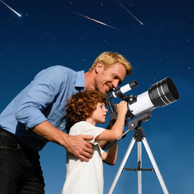 VJJB family outdoors using telescope for shared learning and enjoyment
