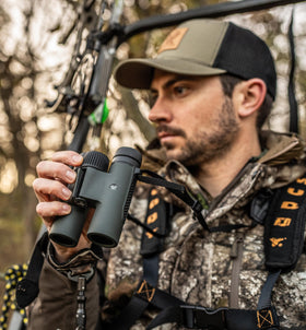 Vortex Triumph HD 10x28 binoculars warranty seal highlighting unlimited VIP coverage.