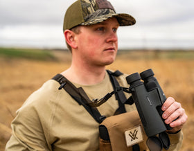 Vortex Triumph HD 12x50 binoculars included neck strap for quick access.