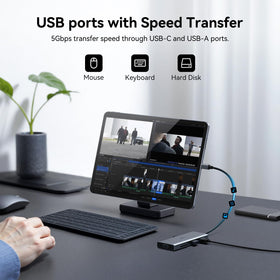 VVB docking station next to laptop showing scale for portable desktop benefit