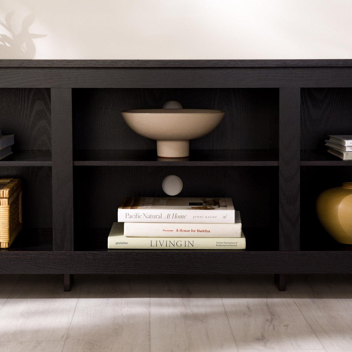 Adjustable shelves inside the Walker Edison Wren Classic 6-Cubby stand for flexible storage