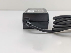 WEALLGOOD charger plugged into Dell laptop on desk showing reliable power
