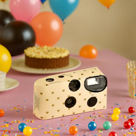 Weddingstar disposable camera with built-in flash provides clear indoor photos.