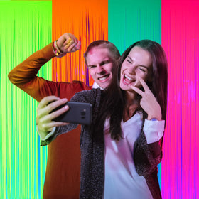 Weysat neon foil fringe rose red backdrop creates bold visuals