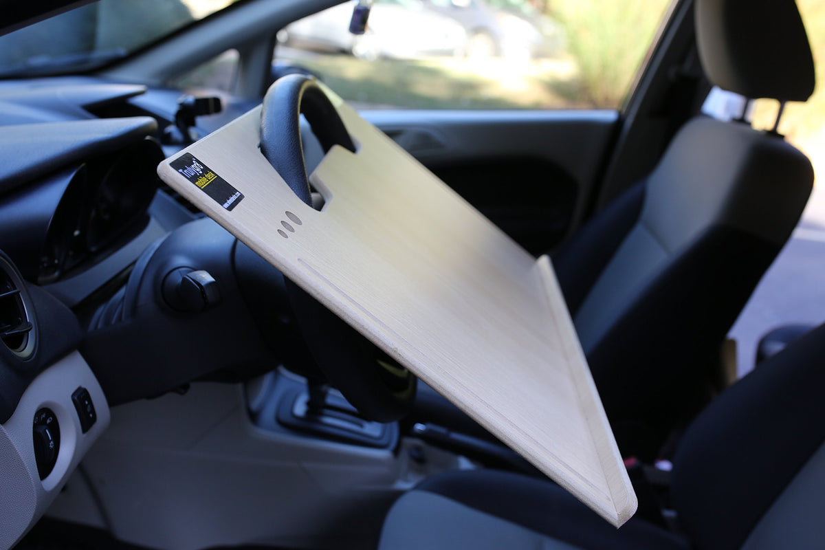 Wheeldesk mounted in a truck showing stable setup and ergonomic posture
