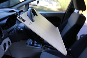 Wheeldesk mounted in a truck showing stable setup and ergonomic posture