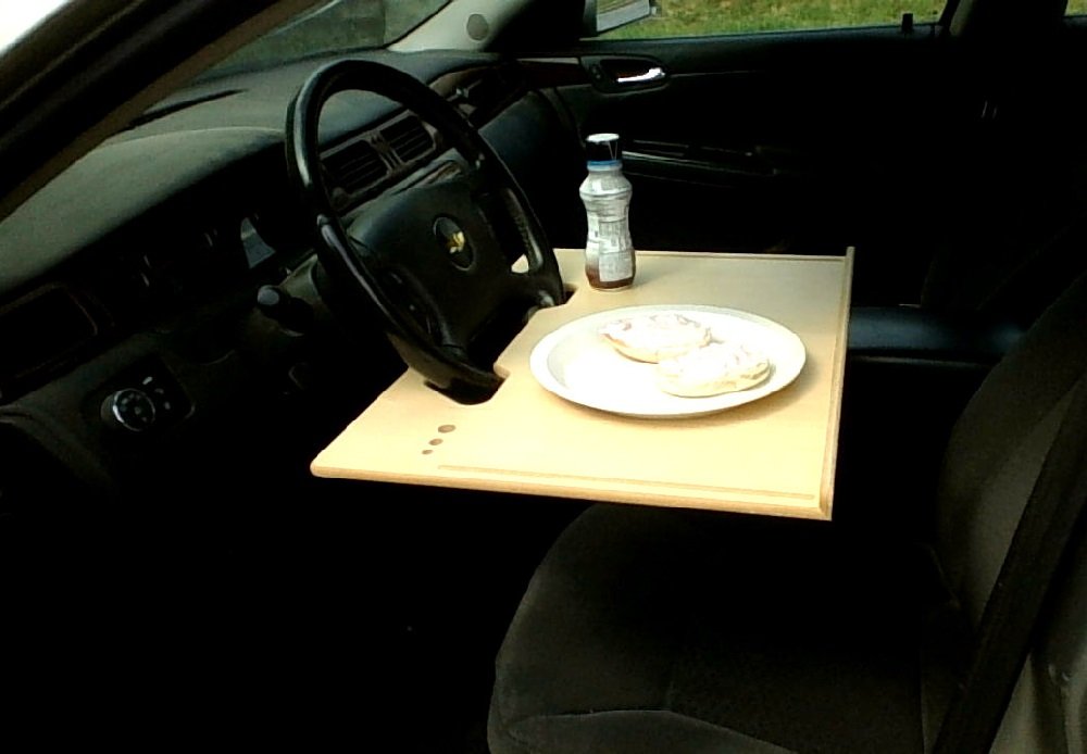 Wheeldesk in a field vehicle with professional using it showing mobile productivity