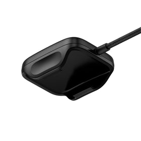 WHOOP device seated in charger cradle demonstrating on-wrist charging convenience benefit