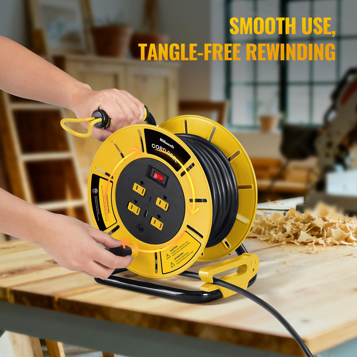 Garage scene with WILAWELS reel supporting long 12/3 cords (80 ft).