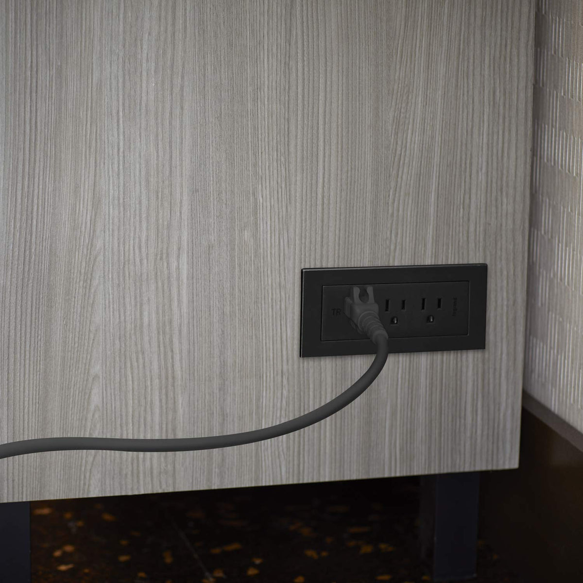 Wiremold close-up on outlets showing tamper-resistant shutters for safety