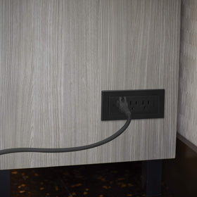 Wiremold close-up on outlets showing tamper-resistant shutters for safety