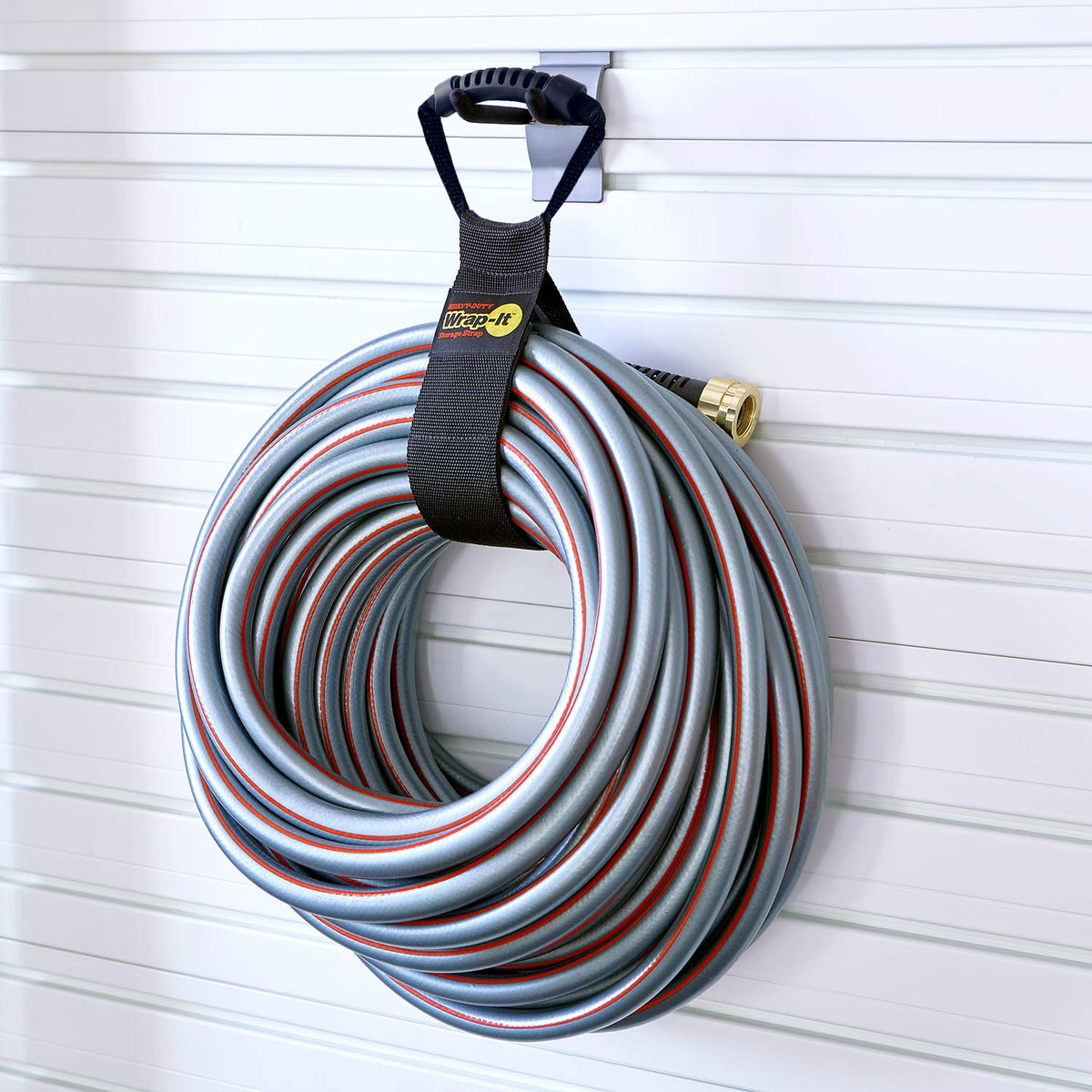 Wrap-It Storage Easy-Carry Strap stores bulky items compactly and neatly.