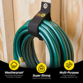 Wrap-It Storage strap organizing extension cords and hoses in a garage.