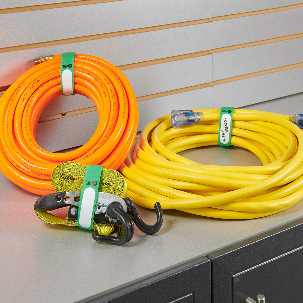 Wrap-It Storage 12-pack green cinch straps ready for home organization and reuse.
