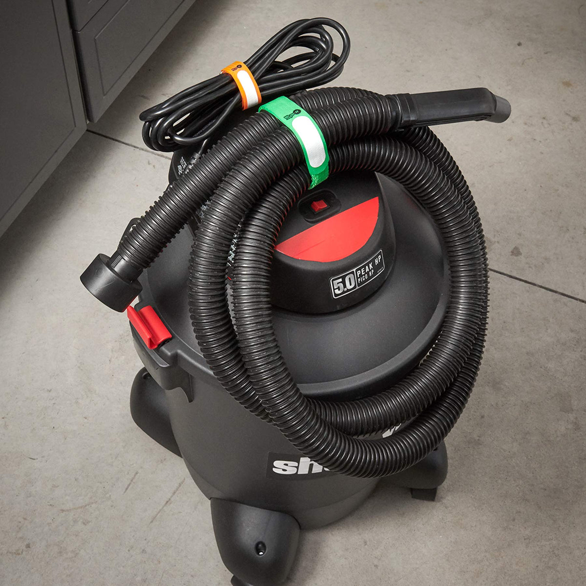 Wrap-It Storage Cinch-Straps organized cords in garage