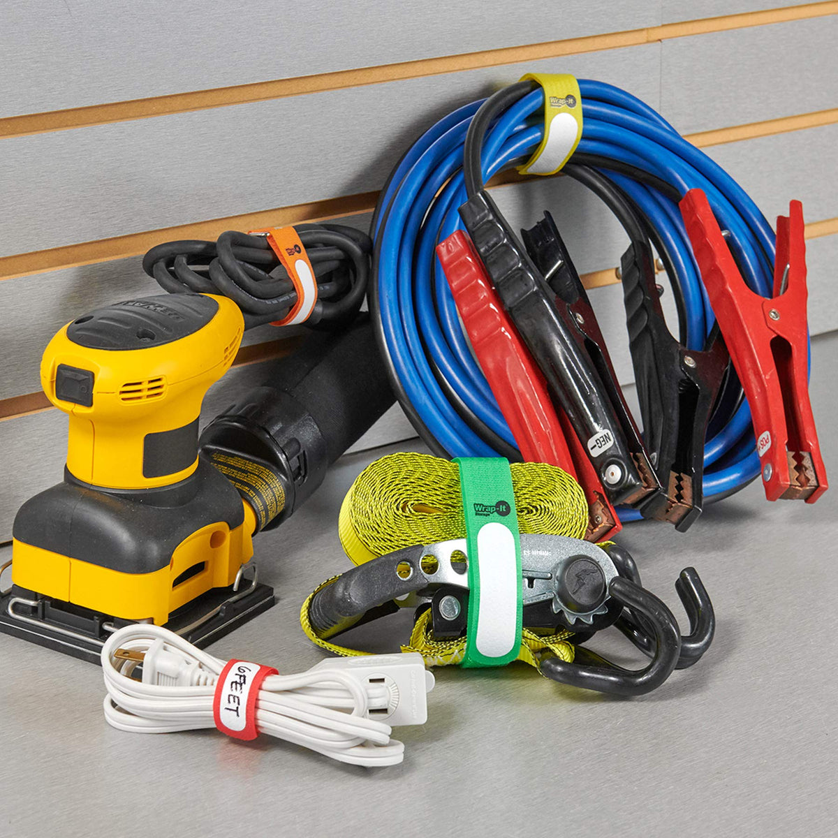 Wrap-It Storage Cinch-Straps on a desk setup for tech organization.