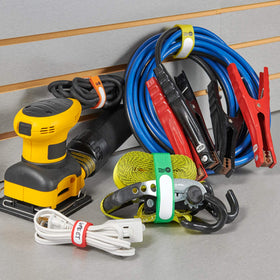 Wrap-It Storage Cinch-Straps on a desk setup for tech organization.